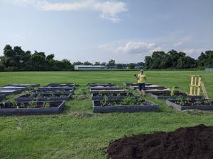 Volunteers came out to help weed, prep, and plant on the LaLumier community garden work day. 