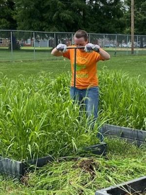 Volunteers came out to help weed, prep, and plant on the LaLumier community garden work day. 